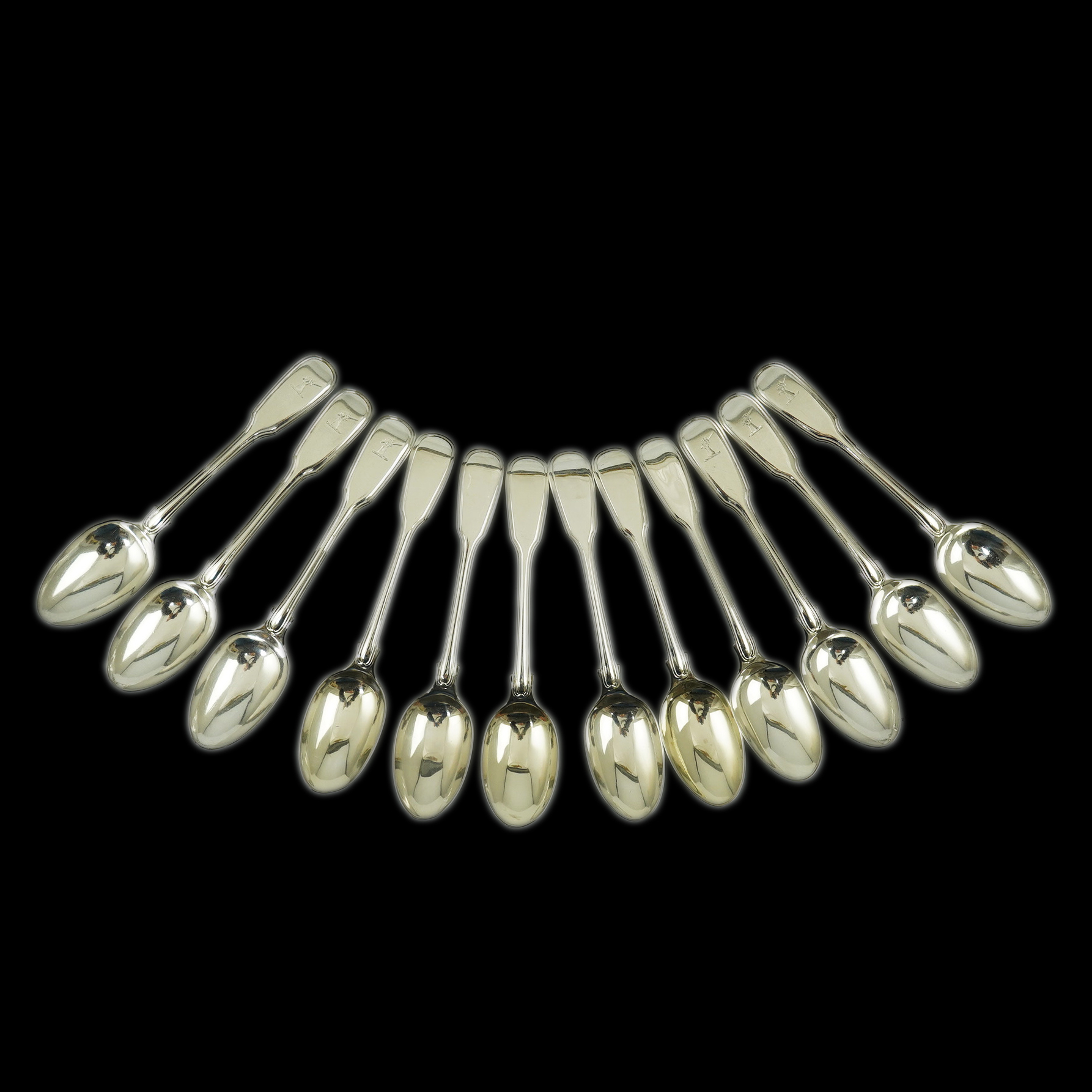 Two sets of six William IV silver fiddle and thread pattern teaspoons, one with engraved crest, William Chawner II, London, 1831 and Mary Chawner, London, 1836